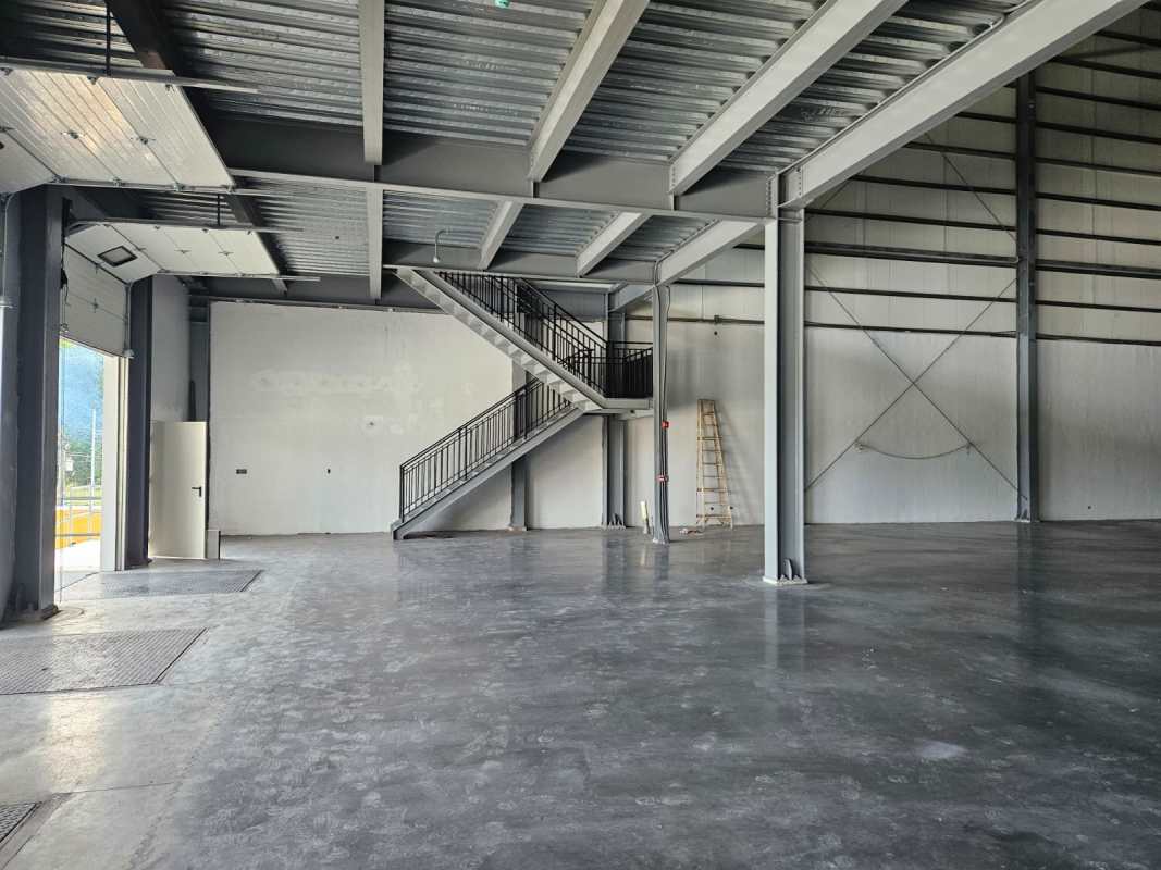 Empty industrial warehouse interior with high ceilings exposed steel at Lefevre Industrial Park Panama City