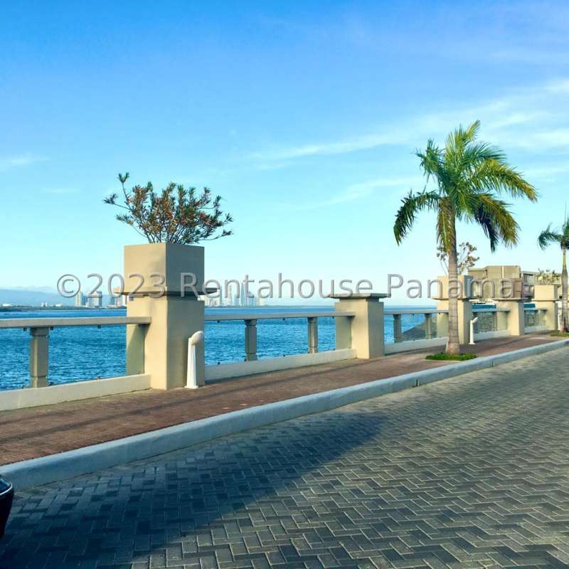 Modern minimalist kitchen with built-in cabinets and pantry in luxury Ocean Reef condo Panama