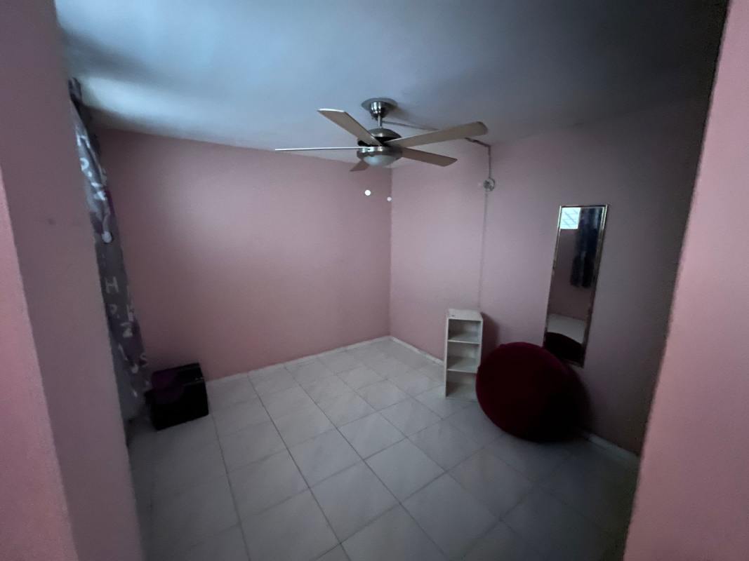 Compact kitchen with granite counter, cabinets, and tile backsplash in PH Plaza Continental Panama