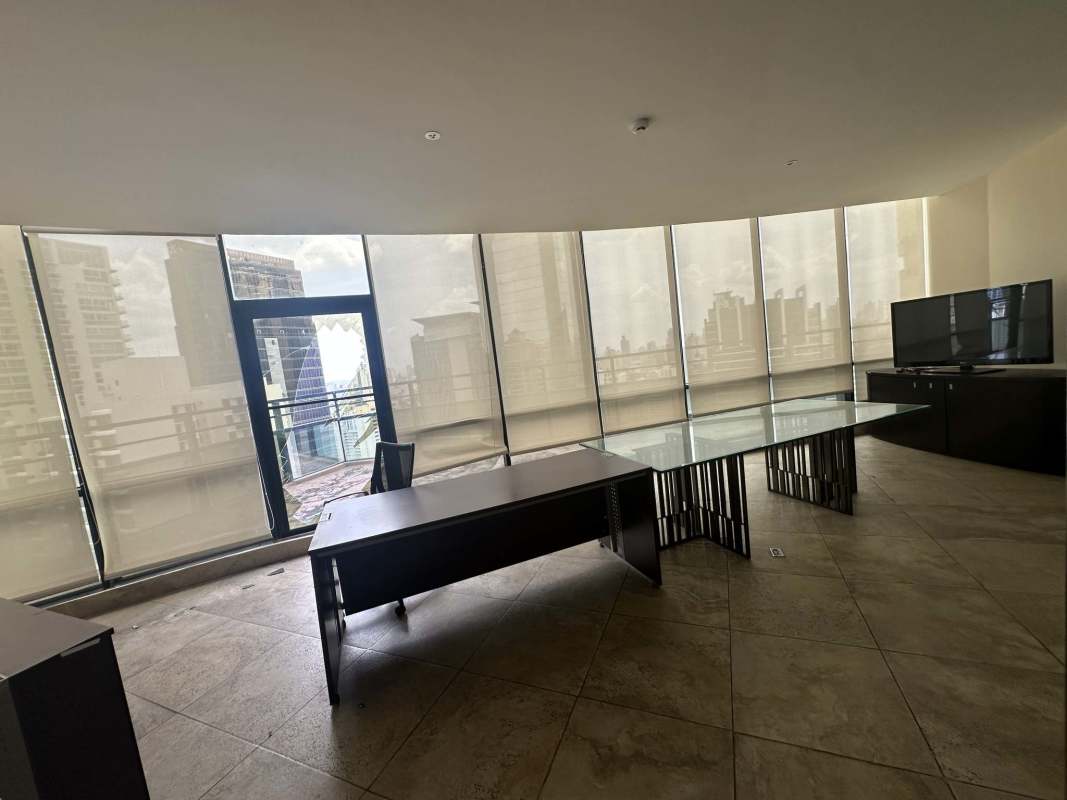 Executive conference room in Torre Generali office tower with glass table and large windows