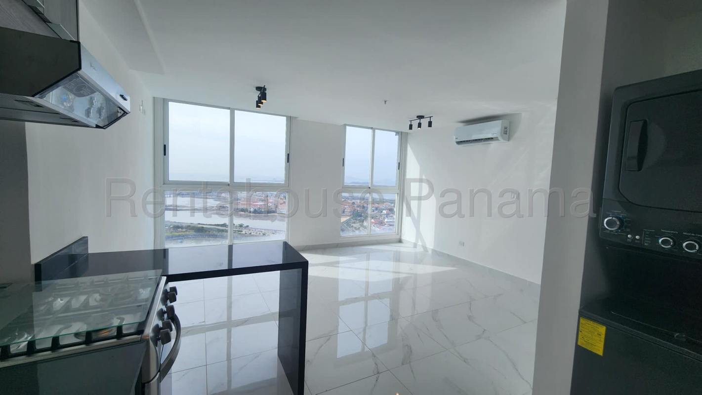 Bright living area with large windows facing ocean and modern finishes in PH BICSA Tower Panama City