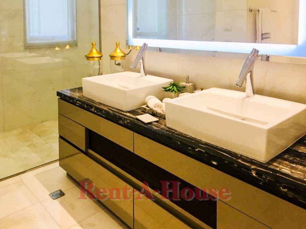 Modern bathroom double vanities marble finishes glass shower PH The Residences Panama City