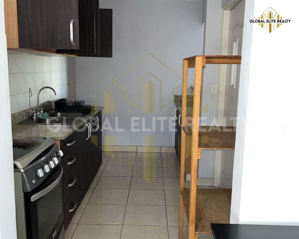 Kitchen with granite countertops, cabinets, and appliances in PH Hato Pintado Central, Panama City