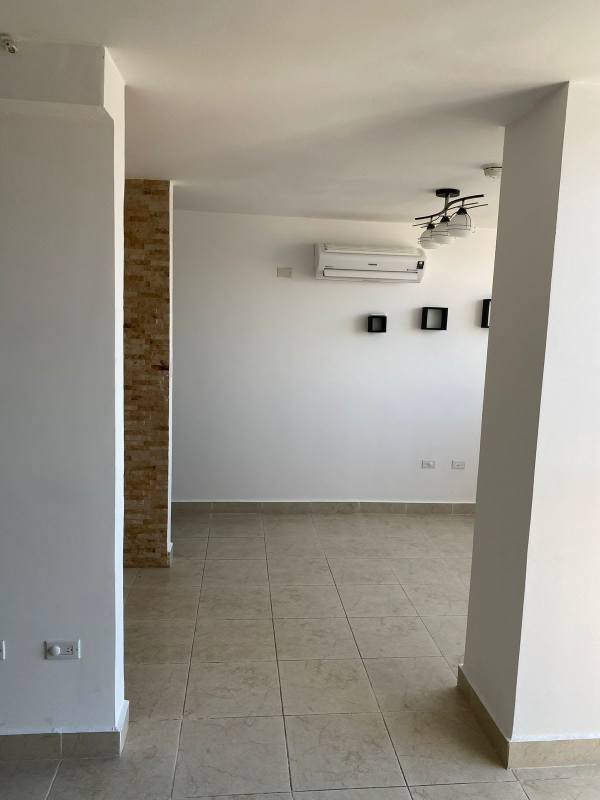 Narrow kitchen with granite counters, tile backsplash and window PH Vista Marina Tower Panama City