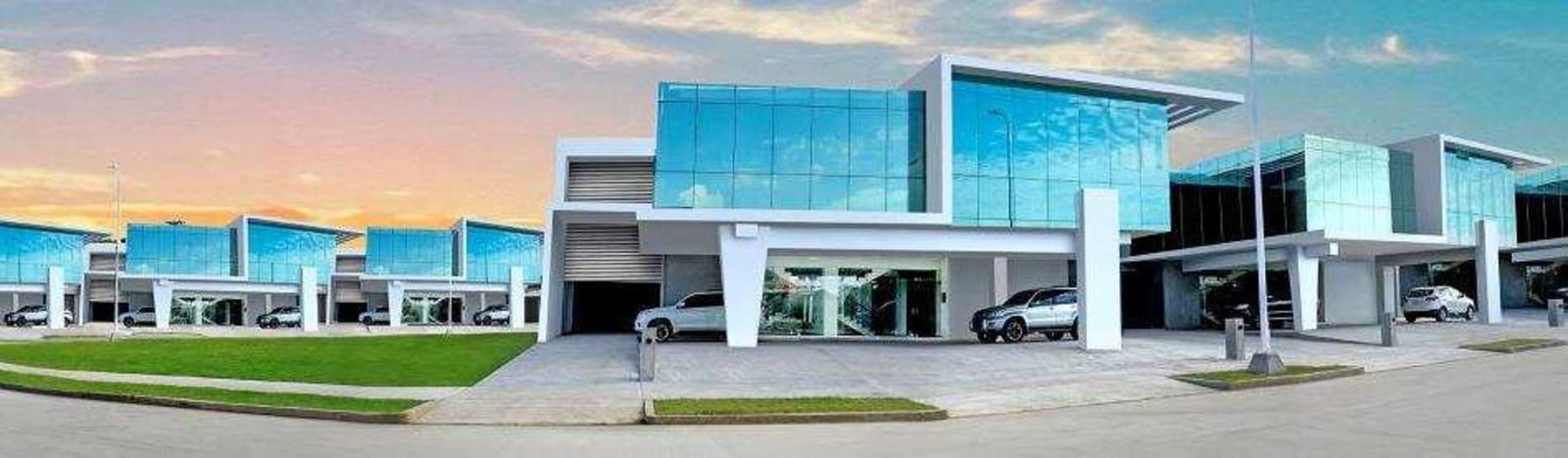 Modern commercial warehouse units with glass facades, metal finishes and parking at Panama Viejo Business Center.