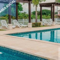 Modern community swimming pool with pergola and lounge chairs in Costa Verde Panama