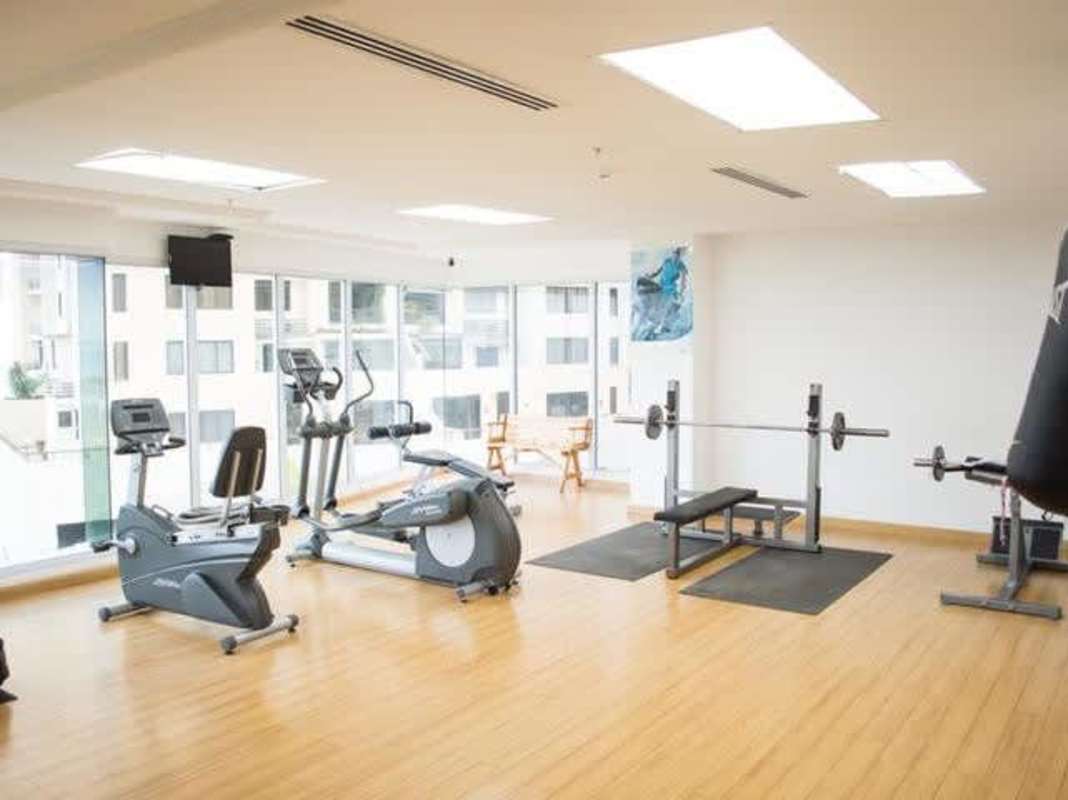 Bright living dining area with panoramic windows and balcony Punta Pacifica Panama