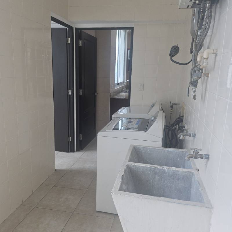 Spacious kitchen with granite countertops and wooden cabinets PH Ocean Drive Punta Pacifica