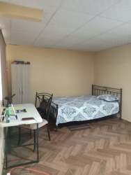 Minimalist kitchen with open shelving, window, refrigerator in house Nuevo Emperador Arraiján