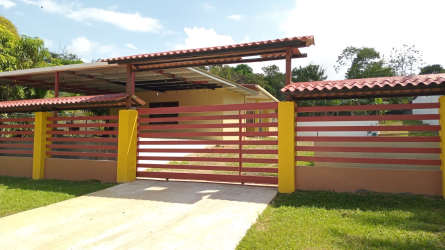Covered terrace patio overlooking yard at Nuevo Emperador house for sale Panama