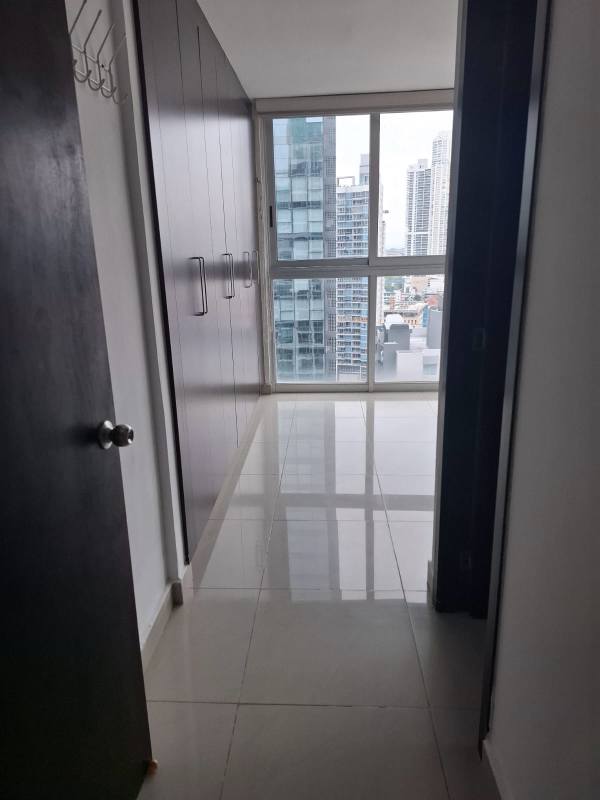 Furnished master bedroom with large window at PH Belle View Tower, Bella Vista, Panama City