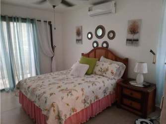 Bedroom balcony garden views AC ceiling fan PH Villa Azul Playa Blanca Panama beachfront condo for sale