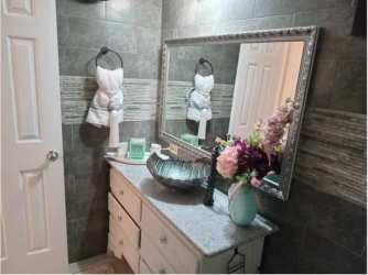 Modern bathroom granite countertop vessel sink tile PH Villa Azul Playa Blanca beach condo for sale