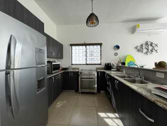 Modern open living dining room with natural light Playa Blanca house private pool