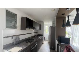 Kitchen with granite counter and cabinets in PH La Sierra Arraiján Panama