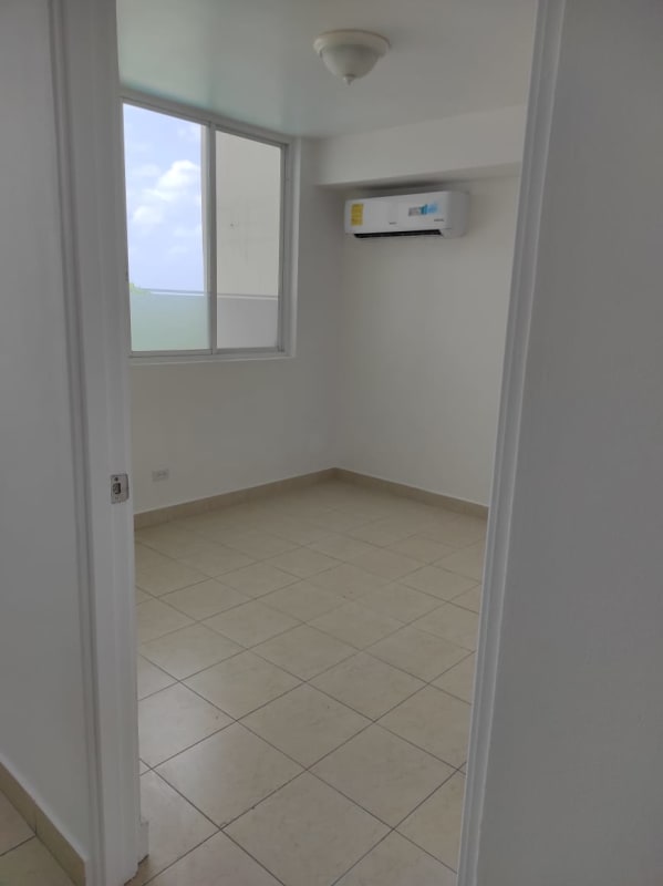 Bright bedroom with split AC and tiled flooring Panama apartment