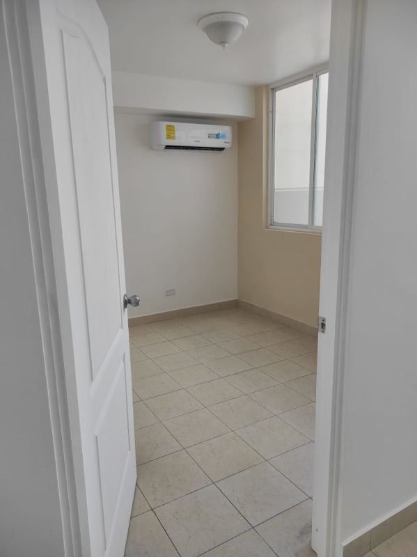 Empty bedroom tiled floors split AC window light Plaza Edison Panama