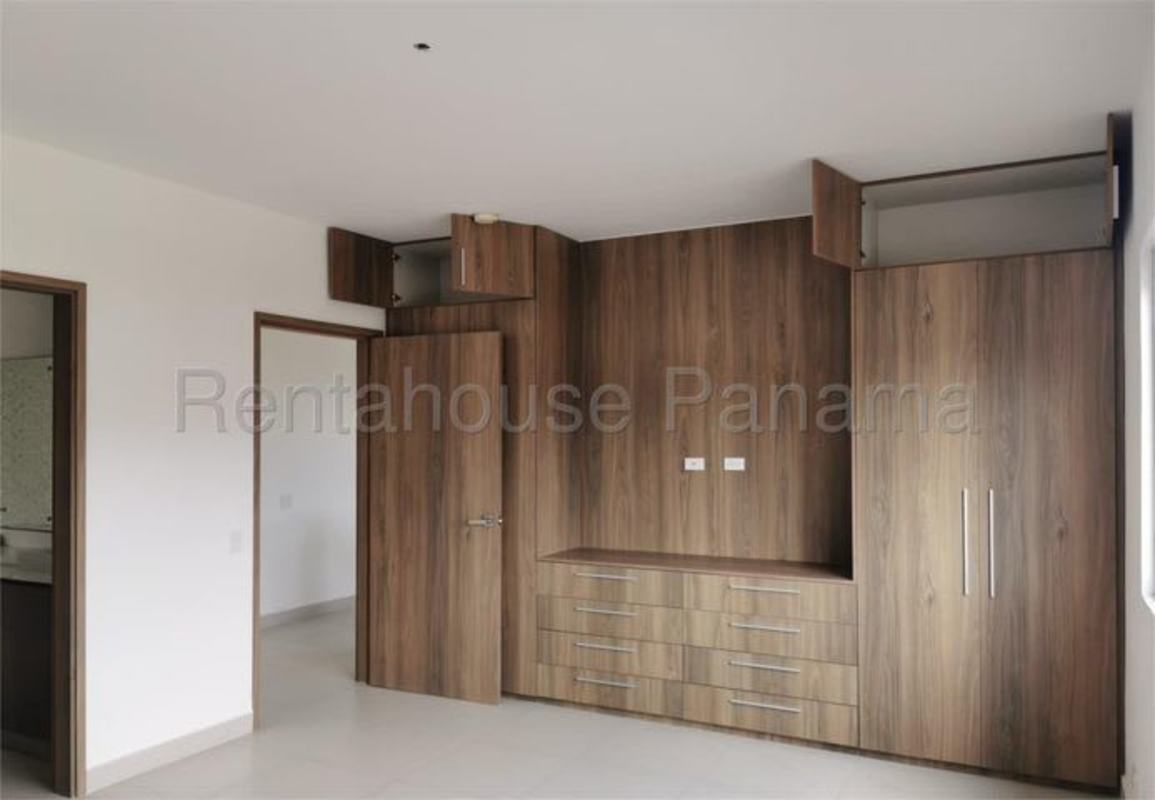 Bedroom with wooden built-in closet drawers and ample storage, Altos del Parque Panama City