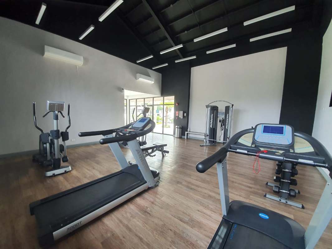 Spacious covered balcony overlooking garden patio in house Paseo del Norte Panama