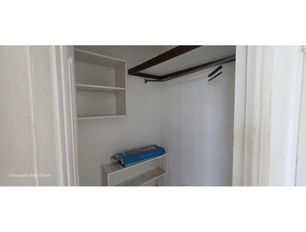 Walk-in closet with shelves and hanging space at PH Royal Center San Francisco Panama