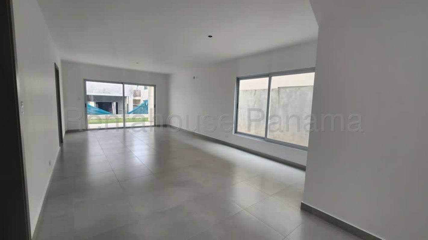 Floating modern staircase with glass railing in luxury house in Altos del Parque Panama