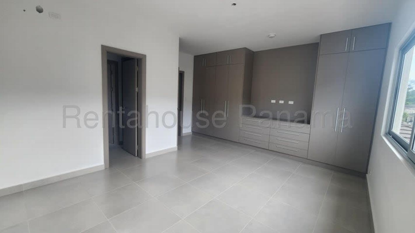 Spacious covered terrace with tile floor and garden view in luxury house Altos de Panamá