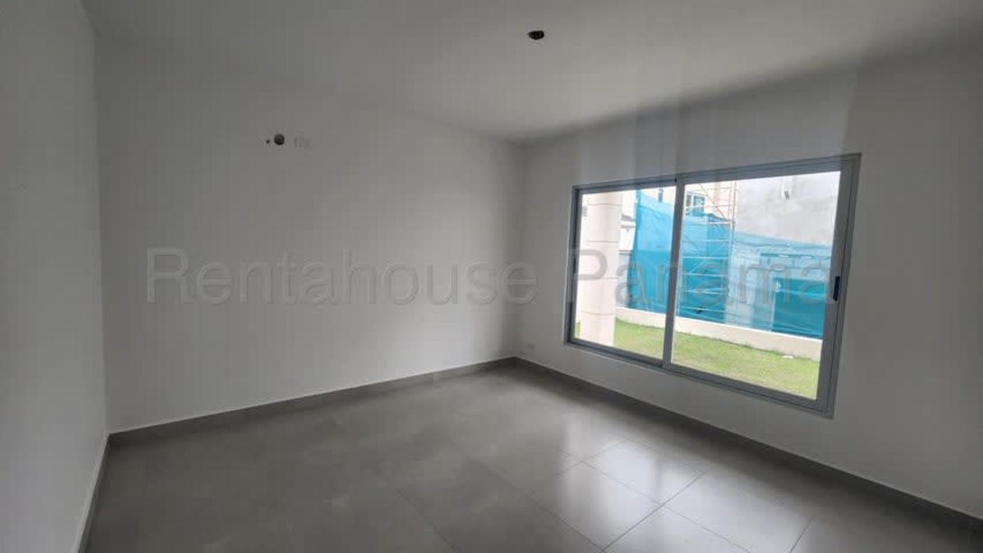 Modern bathroom with jacuzzi tub, glass shower and large window Altos de Panamá luxury house