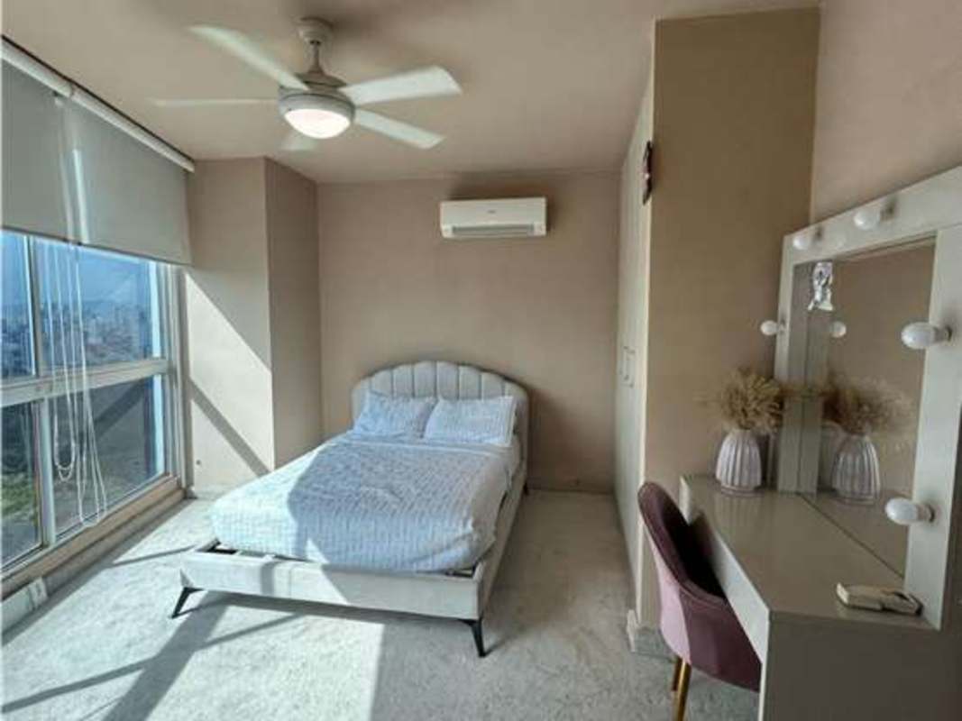 Open-concept loft dining area double height with stairs in PH Park Loft Panama City