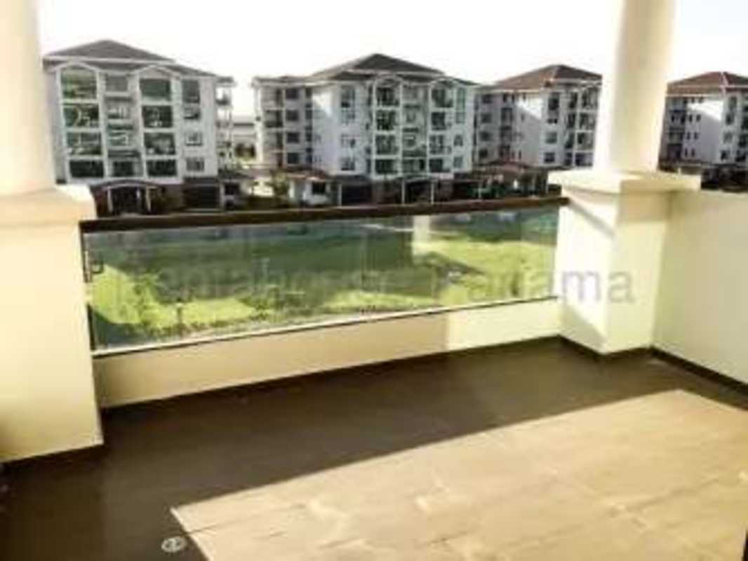 Balcony with glass railing and courtyard views in Costa Sur Panama apartment for rent