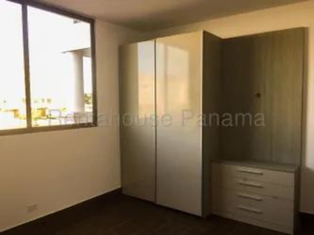 Panama rental condo bedroom with built-in closet, air conditioning and natural light