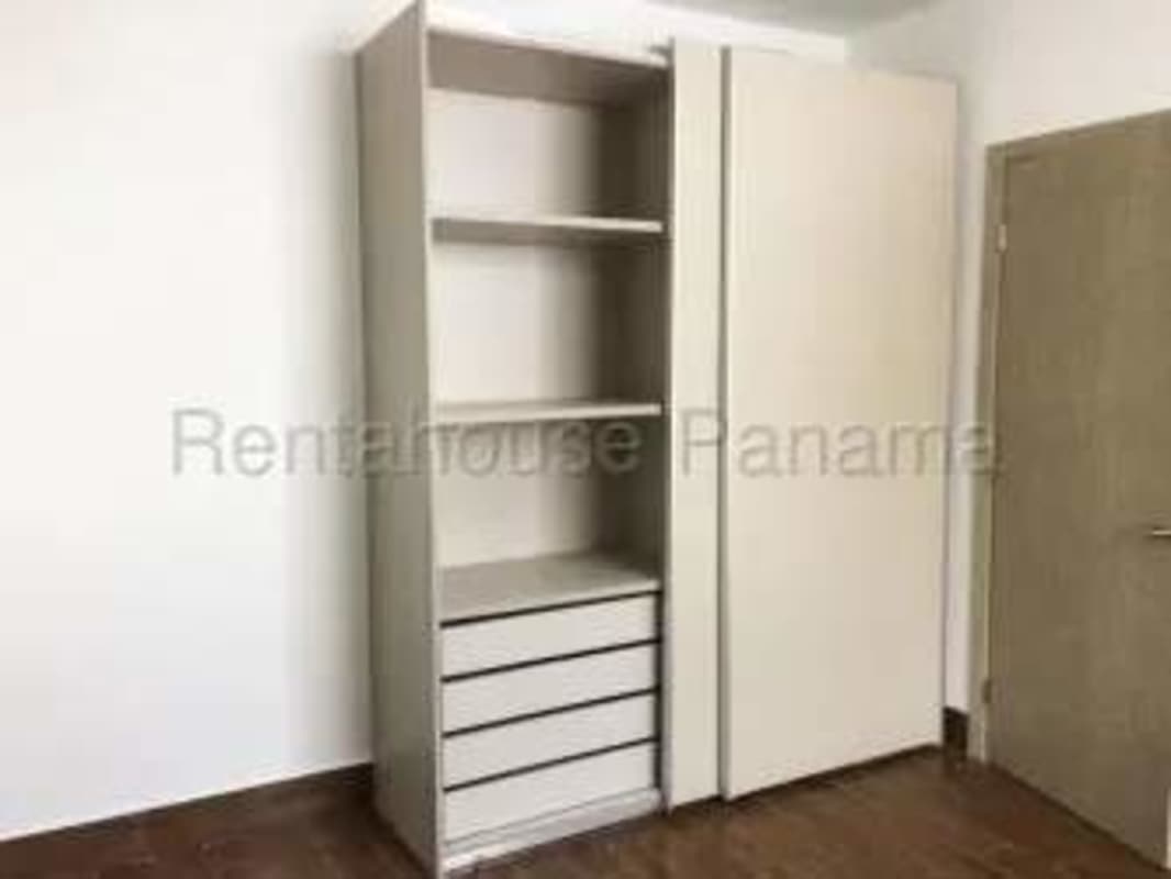 Bedroom with closet, large window and ceramic floors Costa Sur Panama apartment