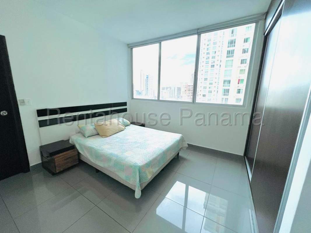 Spacious living and dining area with access to balcony in PH Quartier 74 San Francisco Panama