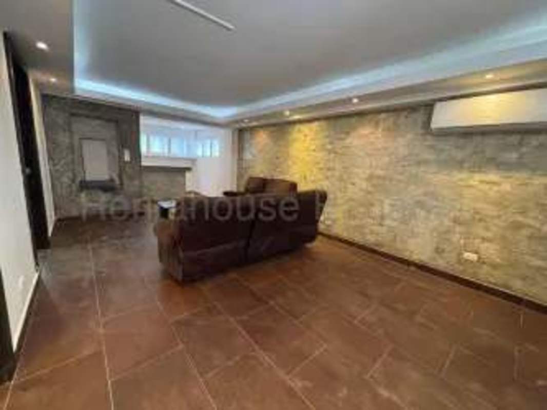 Contemporary living room stone wall tile floor lighting house Altos de Panama