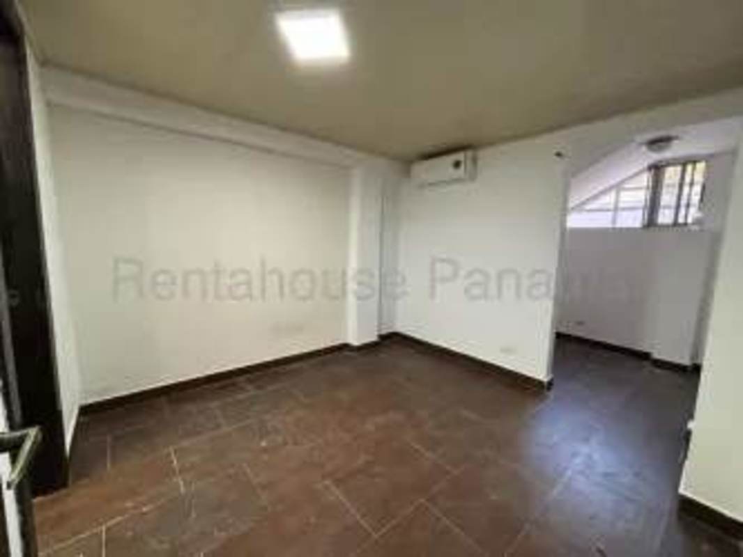 Living room with AC tiled floors bright windows rental home Altos de Santa María