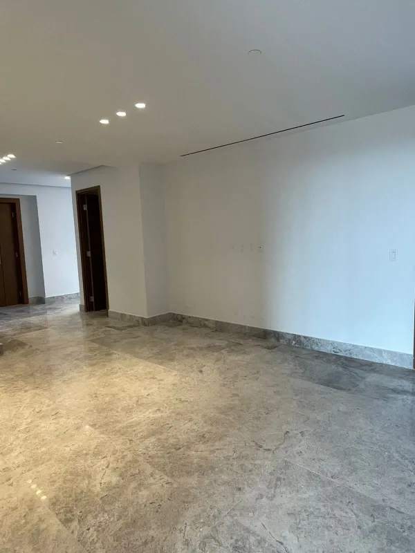 Spacious walk-in closet with custom shelving and marble flooring at PH Empire Santa María Panama