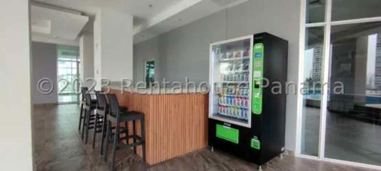 Common lobby area with vending machine, bar counter and lounge PH Sunshine By The Park