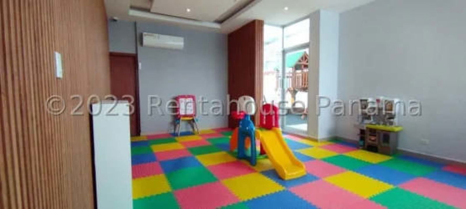 Bright kids indoor playroom with window to green zones PH Sunshine By The Park Carrasquilla
