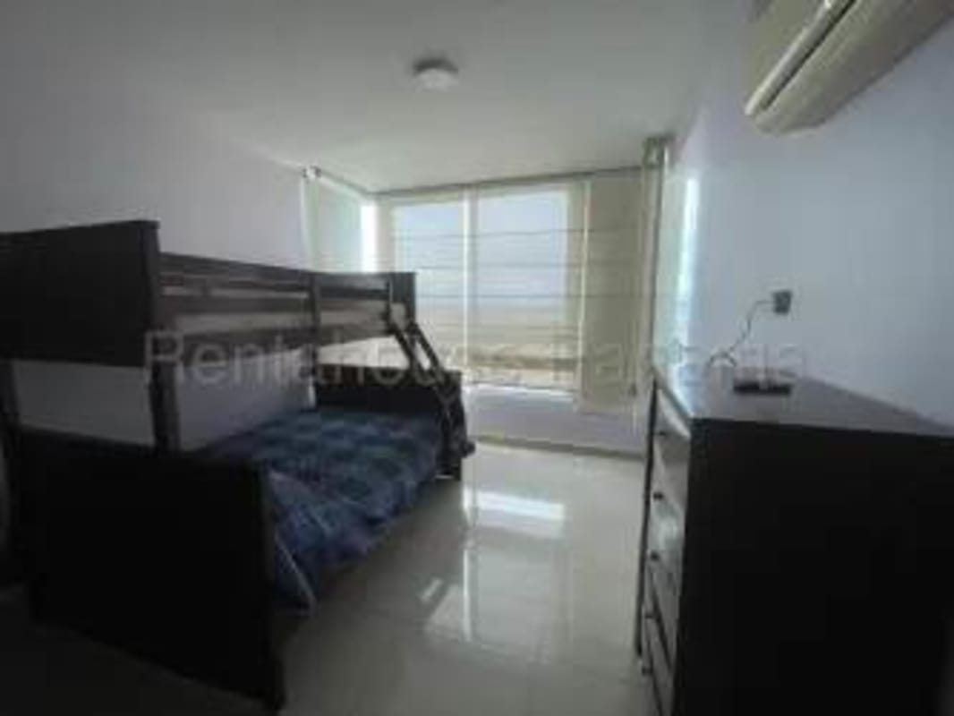 Bedroom with bunk beds, dresser, large window with blinds and AC in Costa View Tower Panama