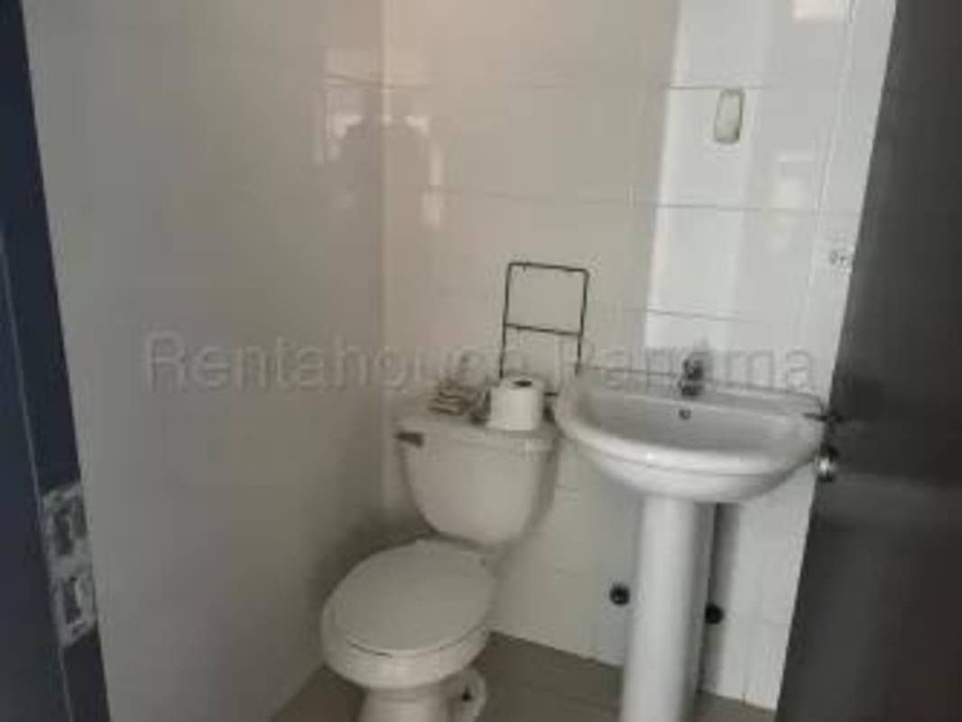 Kitchen with granite counters, laundry appliances, and modern cabinets Costa del Este Panama