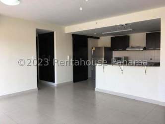 Modern kitchen with granite countertops and appliances in PH Midrise Panama Pacifico