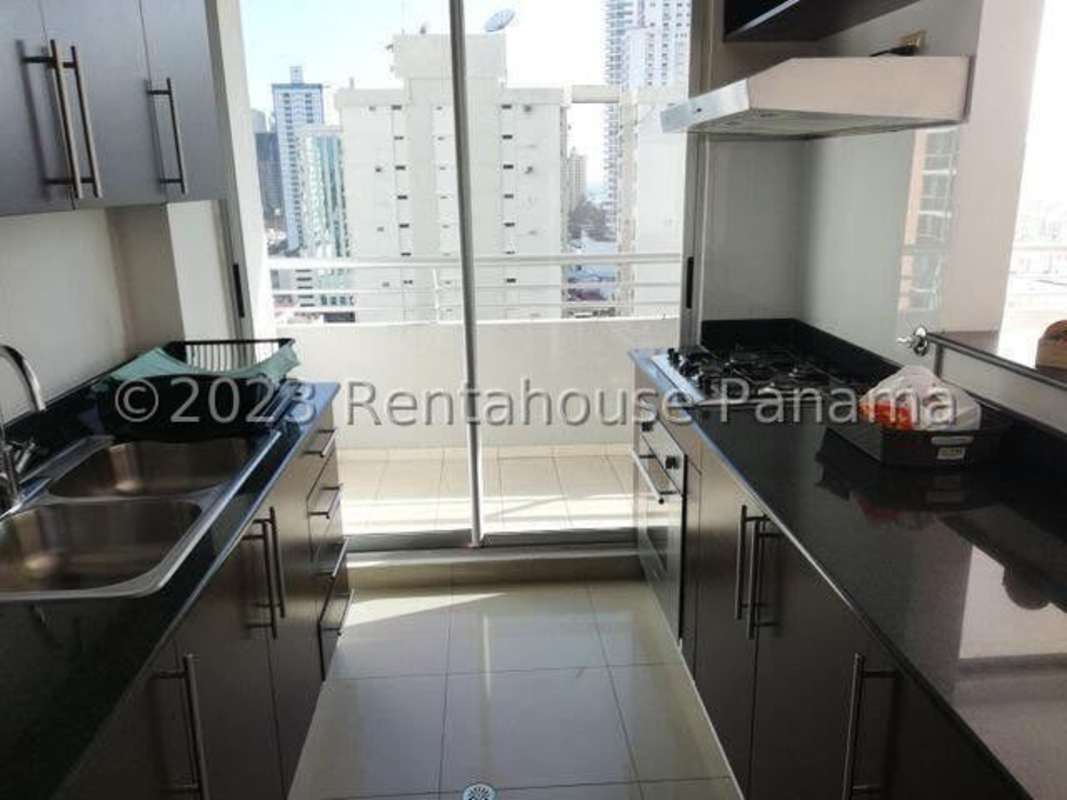 Kitchen equipped with appliances, granite counters, cabinetry at PH Citrus San Francisco Panama