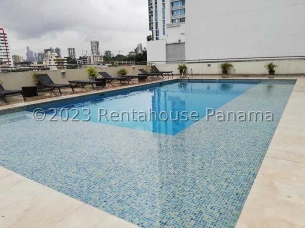Exterior area with covered parking, tropical landscaping and PH Citrus building in San Francisco Panama