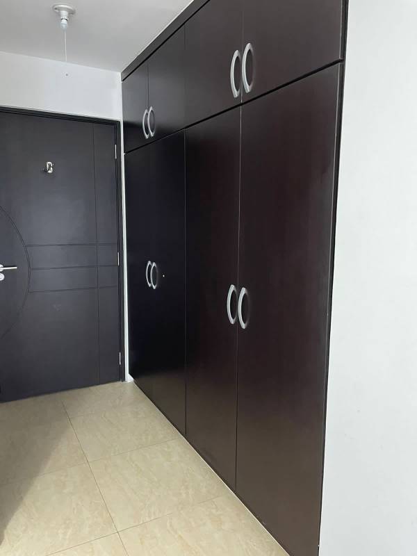 Master bedroom featuring built-in closet and ensuite bathroom in PH Carrasquilla Park Panama City