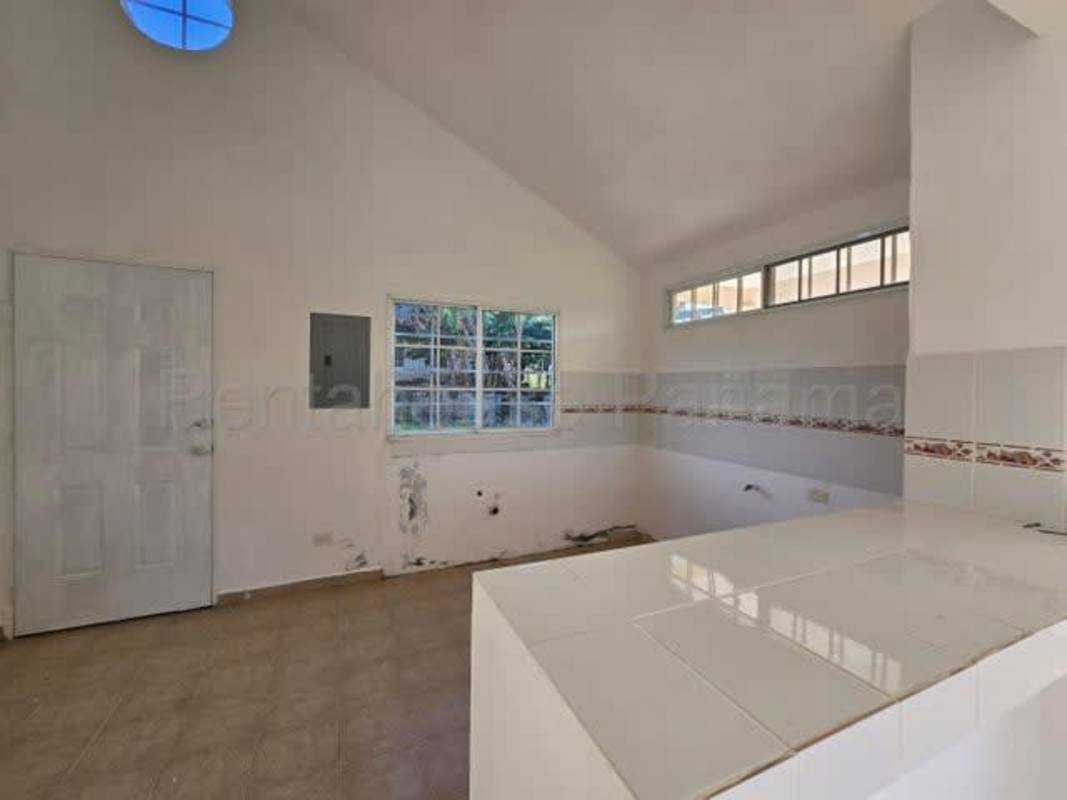 Empty bedroom with window light tiled floors Pacora house sale Panama