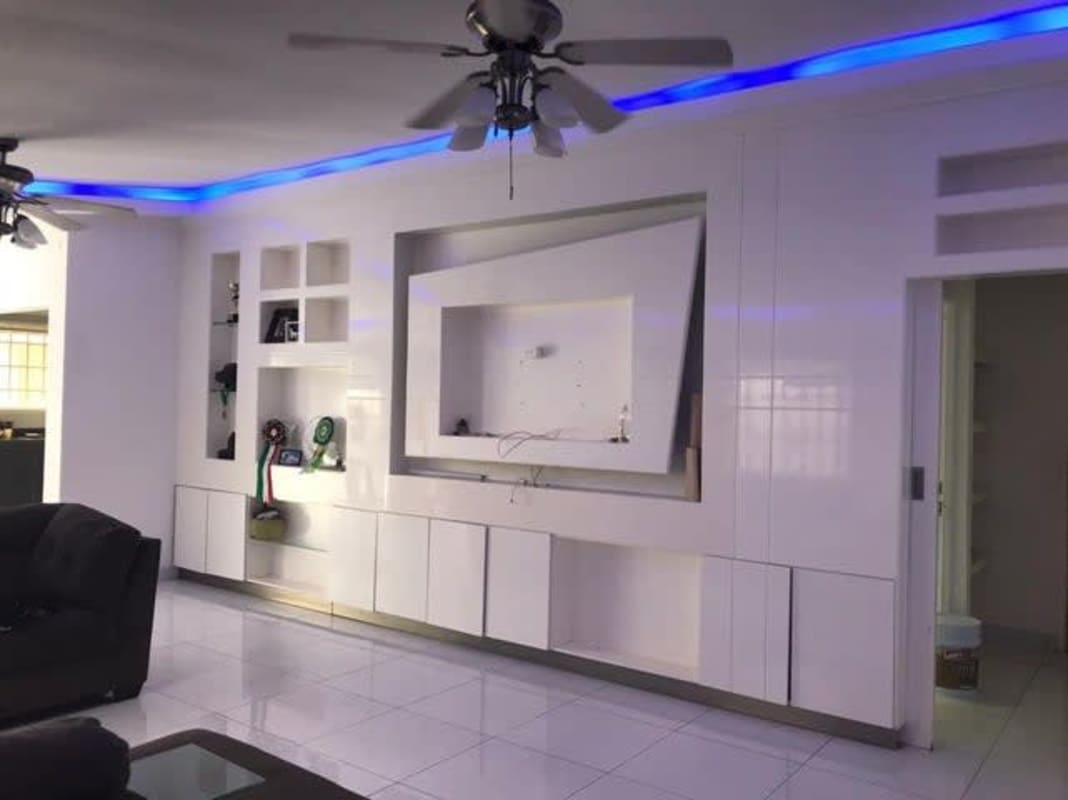 Backyard of house with covered terrace and garden area at Brisas del Golf Panama