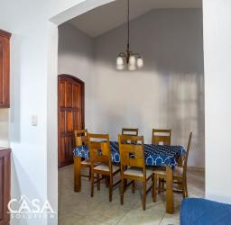 Traditional dining area with archway, wood furniture in PH Cuesta Del Sol David Panama