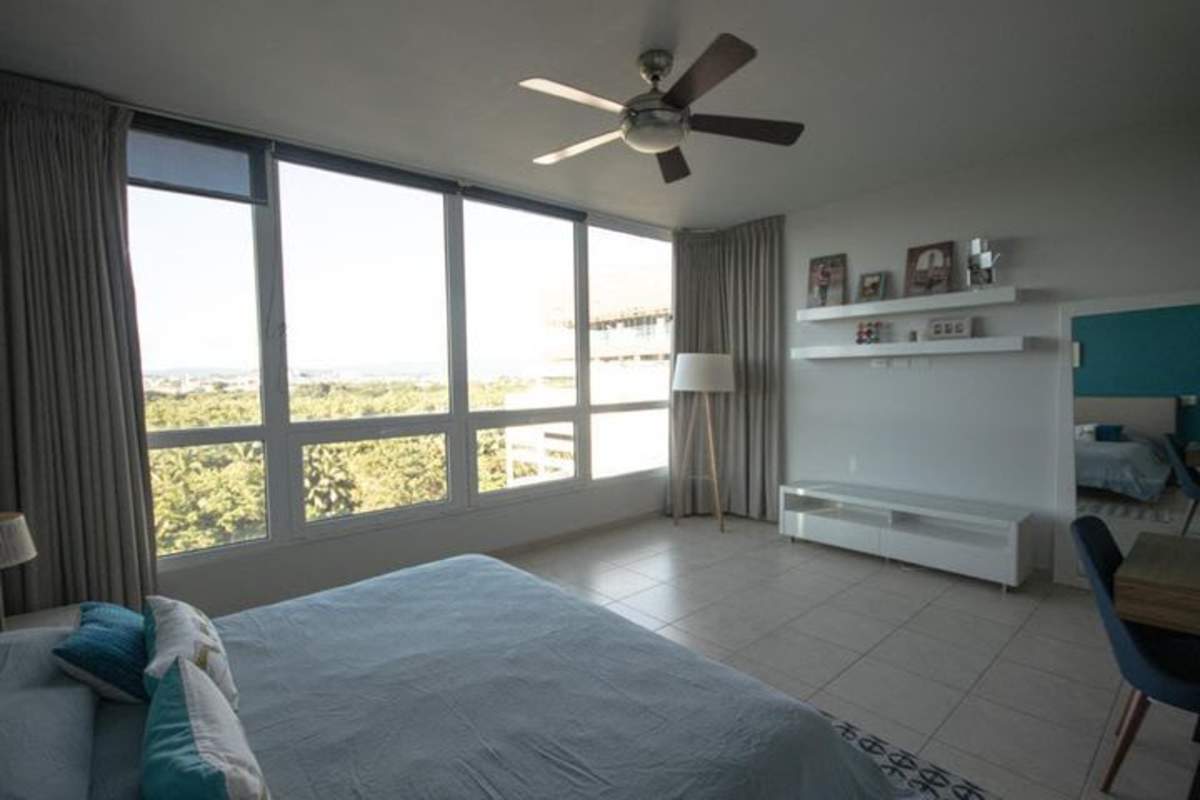 Bedroom with large windows city and green views PH Costa Real Panama