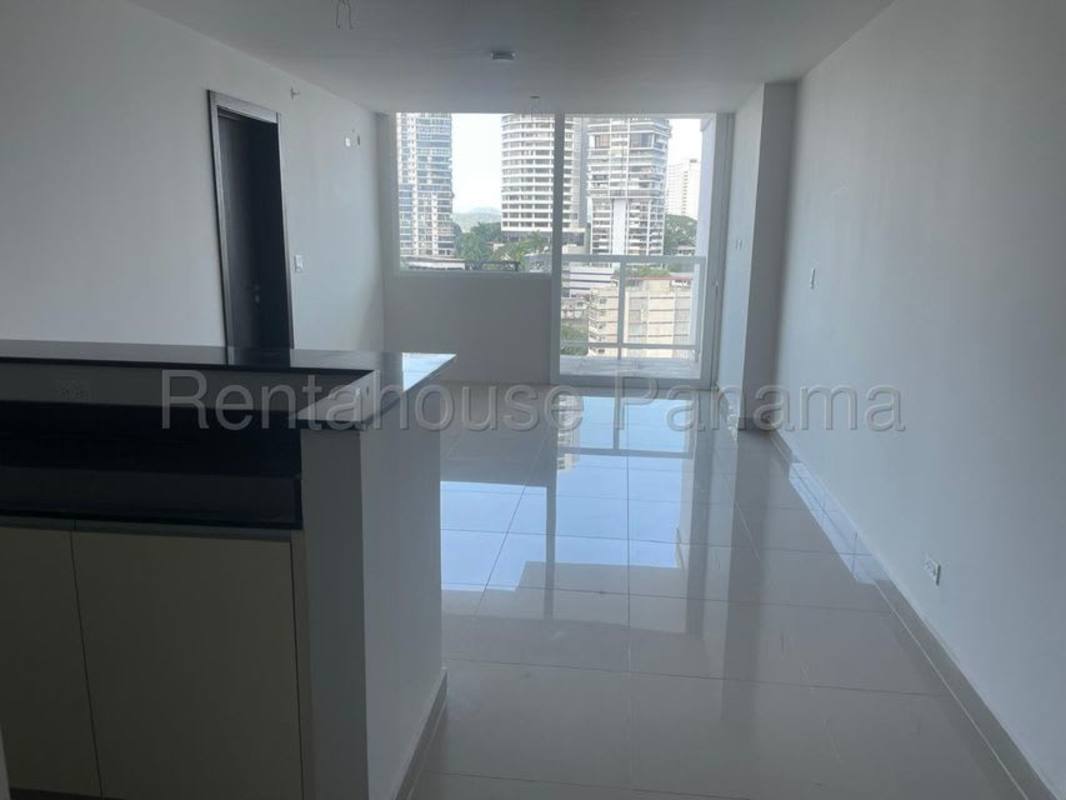 Rooftop swimming pool with lounge chairs, pergola and panoramic city skyline views in Bella Vista Panama