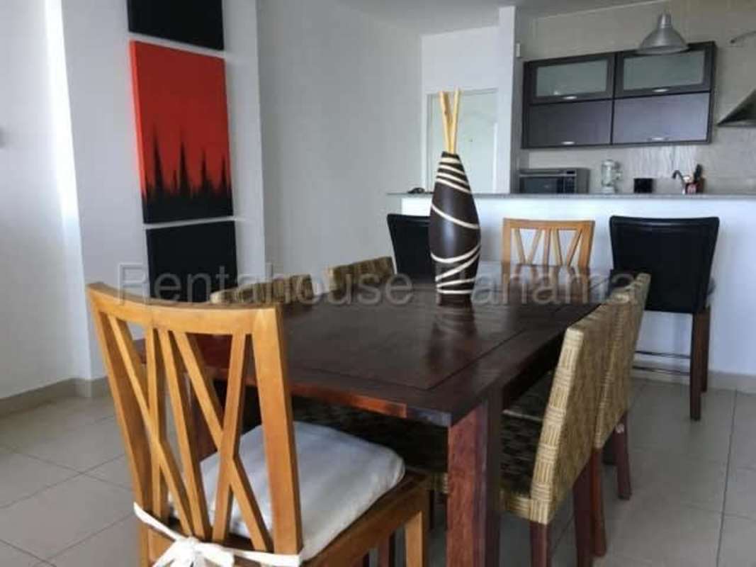 Open dining and kitchen with breakfast bar at PH Met 1 San Francisco Panama