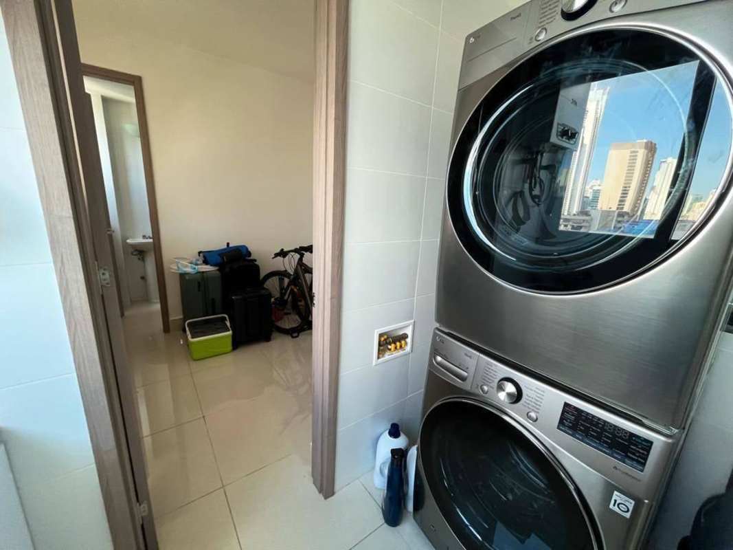 Modern gym with machines and ocean panorama at PH Costanera Panama City